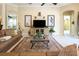 Comfortable living room with a large sectional sofa, stylish decor, and archway, perfect for relaxing or entertaining at 7141 Whitemarsh Cir, Lakewood Ranch, FL 34202