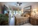This main bedroom features neutral tones, natural light, and classic furniture at 7141 Whitemarsh Cir, Lakewood Ranch, FL 34202