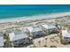Beautiful aerial view of beach homes with balconies overlooking the white sand and ocean at 7490 Palm Island Dr # 2324, Placida, FL 33946