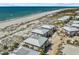 Aerial view of the beachfront properties with a communal pool nestled within the community at 7490 Palm Island Dr # 2324, Placida, FL 33946