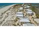 Expansive aerial shot showcases beachfront condos along the coastline with beach access at 7490 Palm Island Dr # 2324, Placida, FL 33946