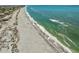 Stunning aerial shot of the coastline, featuring clear turquoise waters and sandy beaches at 7490 Palm Island Dr # 2324, Placida, FL 33946