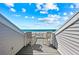 Outdoor balcony with two chairs and a table, and a beautiful view of the beach and ocean at 7490 Palm Island Dr # 2324, Placida, FL 33946