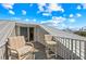 Inviting balcony with comfortable seating, offering a tranquil spot to enjoy scenic ocean views at 7490 Palm Island Dr # 2324, Placida, FL 33946