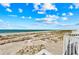 Scenic beach view from a balcony, capturing the serene beauty of the coastline at 7490 Palm Island Dr # 2324, Placida, FL 33946