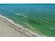 Gorgeous beach view with turquoise water lapping onto the white sand at 7490 Palm Island Dr # 2324, Placida, FL 33946