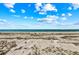 Beautiful and expansive view of beach and ocean with bright blue skies at 7490 Palm Island Dr # 2324, Placida, FL 33946