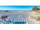 View of the beach with a sign stating, 'No Lifeguard on Duty, Swim at Your Own Risk' in this waterfront community at 7490 Palm Island Dr # 2324, Placida, FL 33946