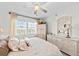 Bright bedroom featuring neutral decor, light colored wicker furniture, and bright windows at 7490 Palm Island Dr # 2324, Placida, FL 33946
