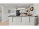 Bright kitchen featuring white cabinets, black appliances, granite counters, and sleek, modern hardware at 7490 Palm Island Dr # 2324, Placida, FL 33946