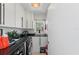 Convenient laundry room with a washer and dryer, black countertops, and ample storage at 7490 Palm Island Dr # 2324, Placida, FL 33946