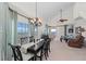 Open-plan living room with views, dining area, chandelier, and comfortable seating at 7490 Palm Island Dr # 2324, Placida, FL 33946