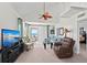 Spacious living room with vaulted ceiling, fan, comfortable seating and a view at 7490 Palm Island Dr # 2324, Placida, FL 33946