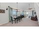 Open-plan living room with views, dining area, chandelier, and comfortable seating at 7490 Palm Island Dr # 2324, Placida, FL 33946