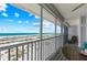Breathtaking ocean and beach views from the screened-in patio, perfect for relaxation at 7490 Palm Island Dr # 2324, Placida, FL 33946