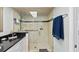 Bathroom featuring a modern, tiled shower with glass doors and a bench at 7490 Palm Island Dr # 2324, Placida, FL 33946