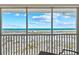 Expansive ocean view from the screened patio, featuring white sands and blue skies at 7490 Palm Island Dr # 2324, Placida, FL 33946