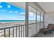 Enjoy this scenic beach view with white sands and clear ocean waters from the screened-in patio at 7490 Palm Island Dr # 2324, Placida, FL 33946