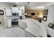 Open kitchen with countertop seating overlooking the living area at 8323 Eagle Isle Pl, Bradenton, FL 34212