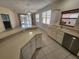 Bright kitchen featuring stainless steel appliances, ample counter space, and an open floor plan at 8323 Eagle Isle Pl, Bradenton, FL 34212