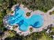 Summerwoods community pool aerial view with lounge chairs and manicured landscaping at 8619 Firefly Pl, Parrish, FL 34219