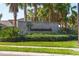 Stone community sign for Summerwoods, set amidst lush landscaping and manicured lawns at 8619 Firefly Pl, Parrish, FL 34219