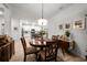 Charming dining area showcasing a round wood table and an open-concept design at 8619 Firefly Pl, Parrish, FL 34219