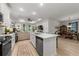 Bright, open-concept living space with a modern kitchen and dining area at 8619 Firefly Pl, Parrish, FL 34219