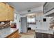 Kitchen with granite countertops, stainless steel refrigerator and view into the living room at 1111 26Th Street E Ct, Palmetto, FL 34221