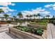 View of the lovely community garden featuring raised garden beds and beautiful plantings at 12720 Sorrento Way # 102, Bradenton, FL 34211