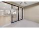 View from outdoor patio to kitchen in this condo; note the neutral color palette and sliding glass doors at 12720 Sorrento Way # 102, Bradenton, FL 34211