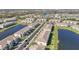 A beautiful aerial view of a townhome community with lakes and lush landscaping at 15147 Sunny Day Dr, Bradenton, FL 34211