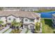 Aerial view of townhomes showcasing landscaped grounds and paved driveways at 15147 Sunny Day Dr, Bradenton, FL 34211