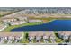 Aerial view showing the community featuring beautiful ponds and new construction at 15147 Sunny Day Dr, Bradenton, FL 34211