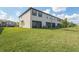 Townhome backyard with lawn featuring an outdoor patio at 15147 Sunny Day Dr, Bradenton, FL 34211