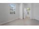 Neutral-toned bathroom featuring a window for natural light and tile floors at 15147 Sunny Day Dr, Bradenton, FL 34211