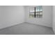 Bright bedroom featuring plush carpet and a window offering natural light at 15147 Sunny Day Dr, Bradenton, FL 34211