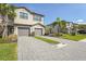 Well-maintained townhome featuring a two-car garage and beautiful landscaping at 15147 Sunny Day Dr, Bradenton, FL 34211