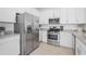 Modern kitchen featuring stainless steel appliances and granite countertops at 15147 Sunny Day Dr, Bradenton, FL 34211