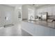 Kitchen with white cabinets, granite countertops, stainless steel appliances and tile flooring at 15147 Sunny Day Dr, Bradenton, FL 34211