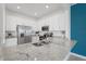 Modern kitchen with stainless steel appliances, granite countertops and white cabinets at 15147 Sunny Day Dr, Bradenton, FL 34211
