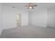 Spacious bedroom boasts soft carpet and multiple doorways at 15147 Sunny Day Dr, Bradenton, FL 34211