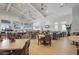 Spacious restaurant area with ample seating, tables, a bar area, and televisions at 15147 Sunny Day Dr, Bradenton, FL 34211