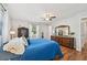 Stylish bedroom with wood floors, natural light and a traditional dresser with a mirror at 1518 49Th E St, Palmetto, FL 34221