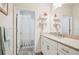 Well-lit bathroom featuring a vanity with granite countertops and a shower/tub combination at 1604 Still River Dr, Venice, FL 34293