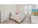 Charming bedroom with white furniture, decorative accents, and a cozy feel at 1604 Still River Dr, Venice, FL 34293