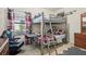 Bedroom with a bunk bed, work station and a comfortable looking gaming chair at 1604 Still River Dr, Venice, FL 34293