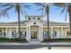 Exterior view of the clubhouse, featuring classic architectural details and a welcoming entrance at 1604 Still River Dr, Venice, FL 34293