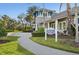 The Social Club and manicured landscaping create an inviting atmosphere in this community amenity at 1604 Still River Dr, Venice, FL 34293