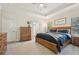 Inviting main bedroom with a tray ceiling, neutral tones, and a serene atmosphere at 1604 Still River Dr, Venice, FL 34293